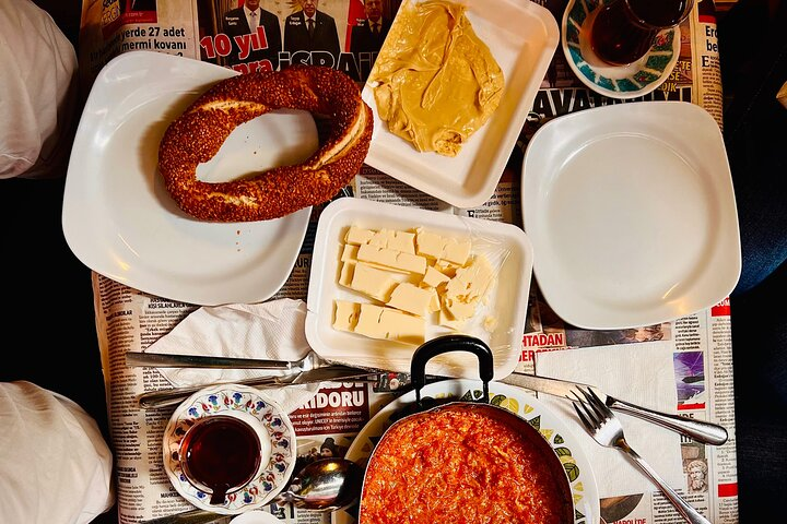 Menemen, cheese, simit bread with sesame, hazelnut paste and çay tea