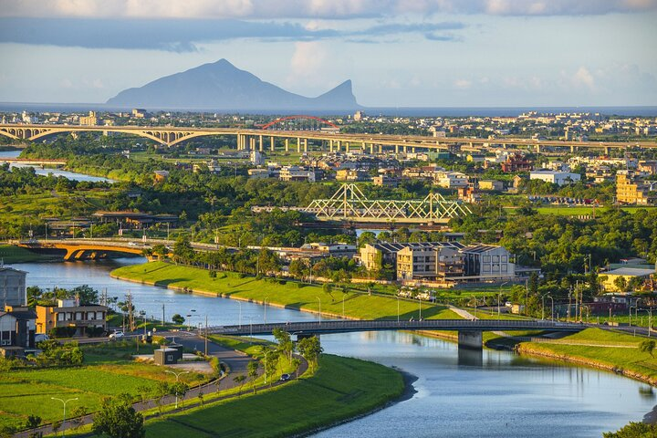 Experience the stunning landscapes of Yilan with its serene rivers lush greenery and iconic mountains perfect for unforgettable photography and exploration during your day tour from Taipei.