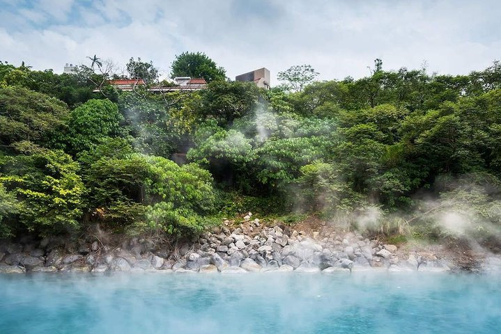 Experience the serene beauty of Beitou's hot springs surrounded by lush greenery and soothing steam offering a unique glimpse into Taiwan's natural wellness and cultural heritage.