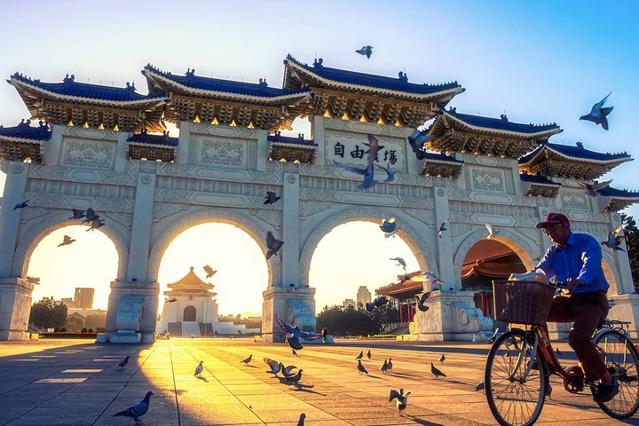 Biking through historic landmarks surrounded by fluttering pigeons at sunset offers an unforgettable chance to explore Taiwan's beauty at your own pace. Discover hidden gems with ease!