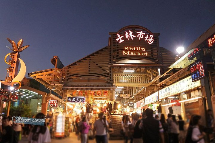 Explore the lively Shilin Night Market where local delicacies and unique finds await. Discover authentic street food and shop for memorable souvenirs under the twinkling night sky.