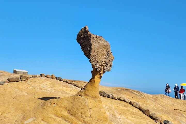 Discover the unique rock formations of Yeliu Geopark where nature’s artistry creates fascinating shapes perfect for memorable photos and exploration during your Taipei day tour.