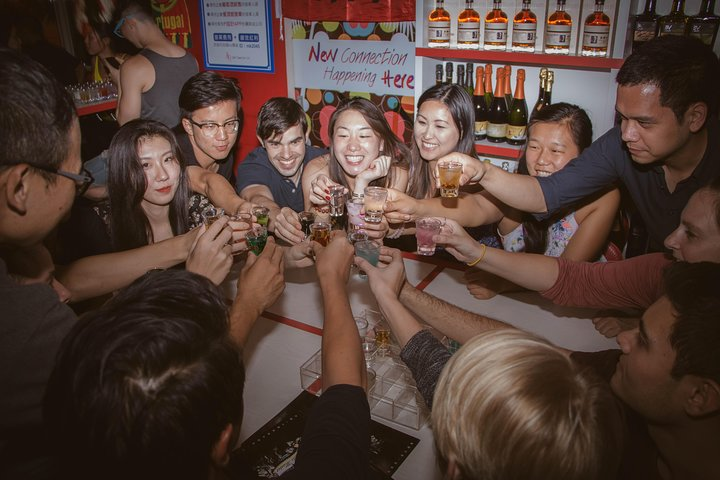 Experience the lively energy of Taipei's nightlife as you raise a toast with friends at local bars savoring authentic Taiwanese drinks and connecting with fellow adventurers.