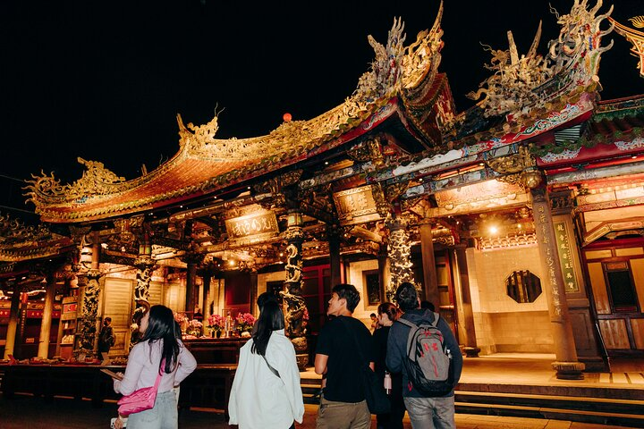 Experience the charm of Longshan Temple at night where intricate architecture meets the essence of Taiwanese spirituality. Discover hidden stories and traditions that have shaped local culture for centuries.