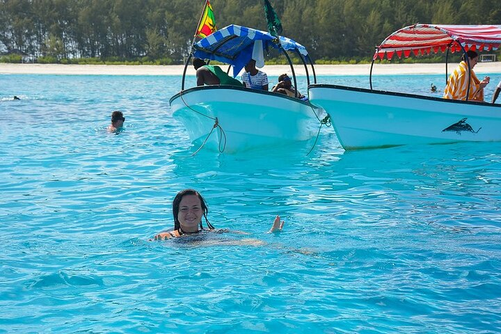 Guests swimming at Mnemba Island