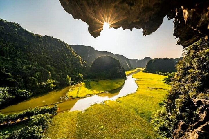 Discover breathtaking landscapes shaped by limestone karsts and lush rice fields inviting exploration of tranquil waterways and hidden caves in this unique slice of Vietnam. An unforgettable adventure awaits.