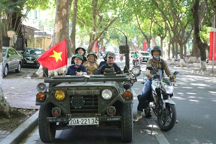 Experience Hanoi's hidden gems from an iconic army jeep cruising through lively backstreets and historic sites. Discover the essence of local life while enjoying scenic views and unique stories.