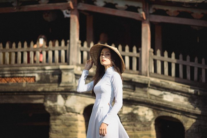 Dressed in the traditional Ao Dai explore the charming streets of Hoi An capturing timeless moments among historic houses and cozy cafes. Immerse yourself in culture while creating lasting memories.