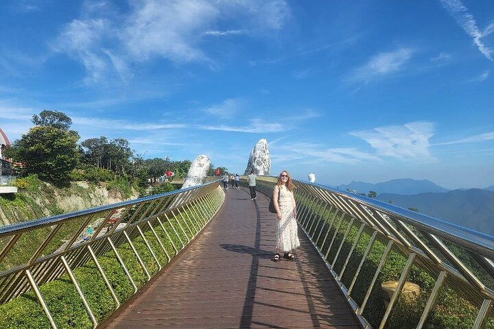 Experience stunning views from the Golden Bridge as you stroll along its breathtaking path. Capture memorable moments amidst the lush surroundings of Ba Na Hills and the French Village.