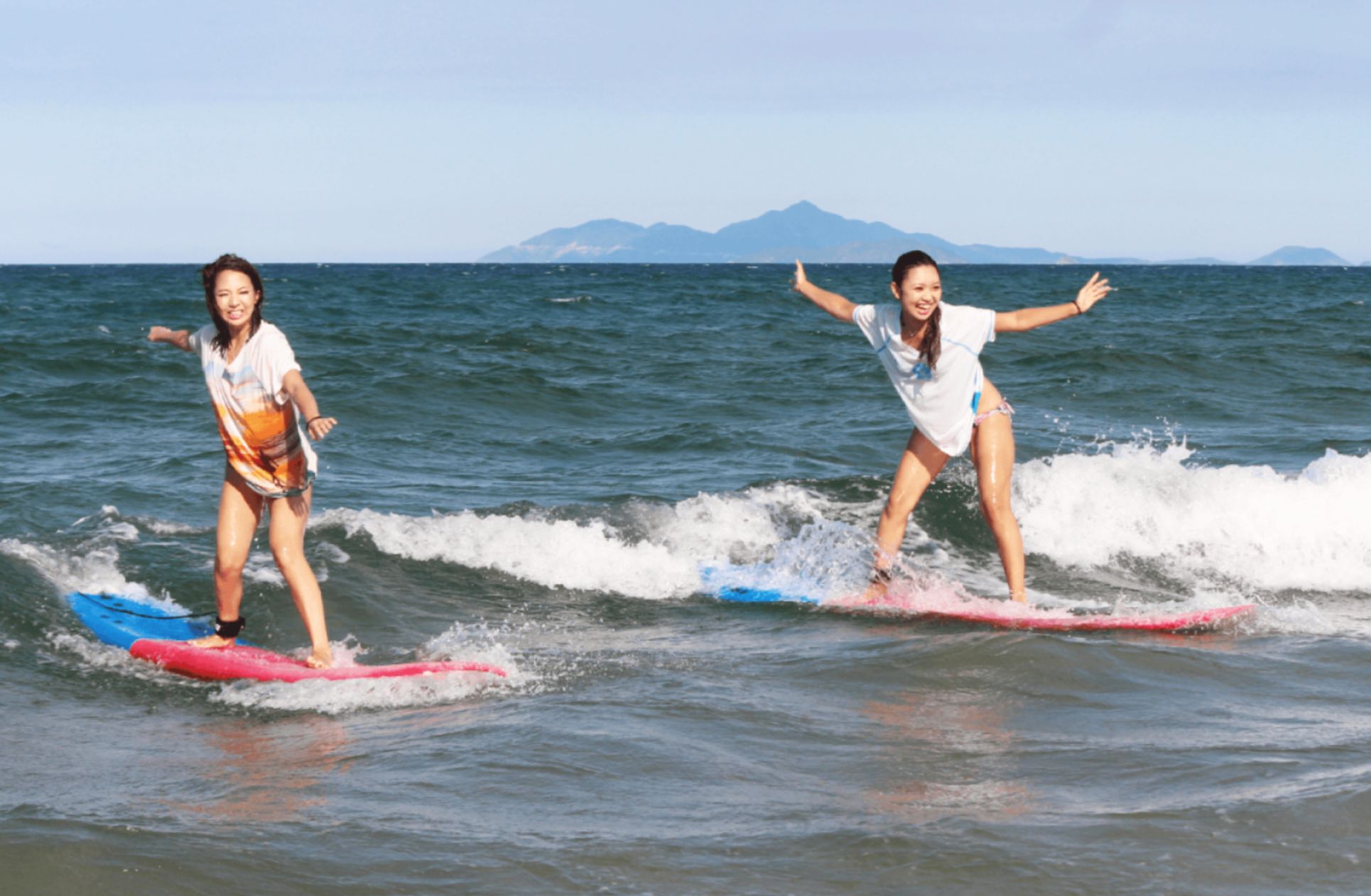 Experience the joy of surfing and stand-up paddleboarding at My Khe beach surrounded by stunning scenery and great company—ideal for creating unforgettable memories.