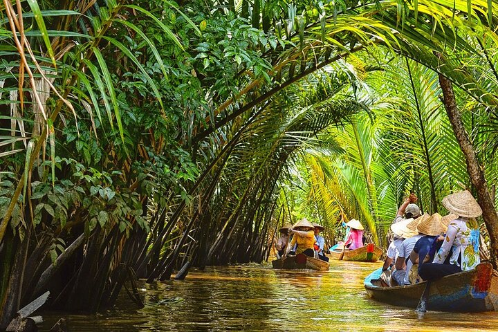 Glide through lush green canals as gentle currents guide you past palm fronds and floating villages experiencing local life at a leisurely pace on this unique Mekong journey.