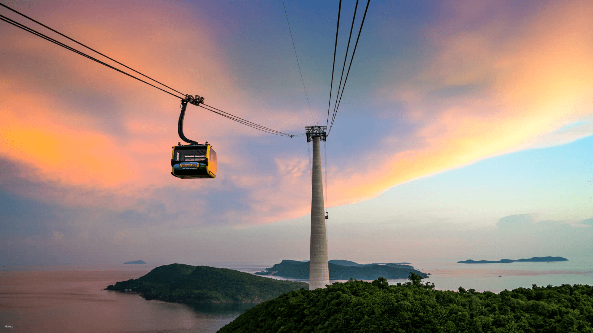 Experience breathtaking sunset views while gliding over Phu Quoc's islands in the iconic Hon Thom cable car. Perfect for capturing memorable moments with stunning ocean backdrops.
