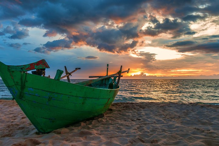 Experience the serene beauty of Phu Quoc as the sun sets behind the horizon casting golden hues over tranquil waters and inviting you to explore its hidden gems.