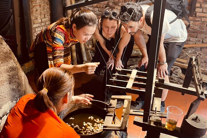 Engage with local artisans as they share the intricate art of silk-making showcasing the delicate transformation from silkworm to fabric in a lively and immersive hands-on experience.