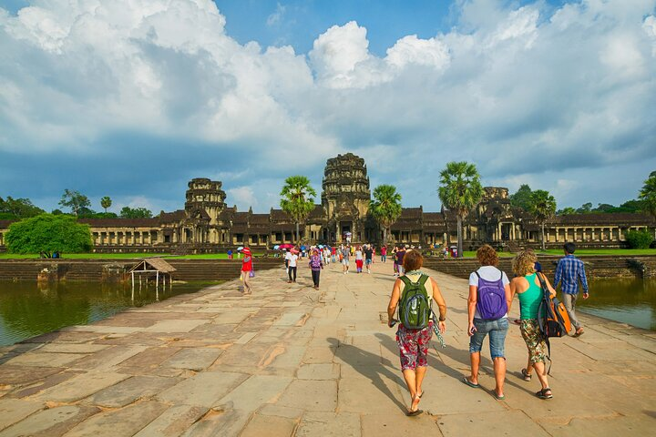 Explore the stunning architecture of Angkor Wat as travelers immerse themselves in the rich history and beauty of Cambodia creating unforgettable memories along the way.