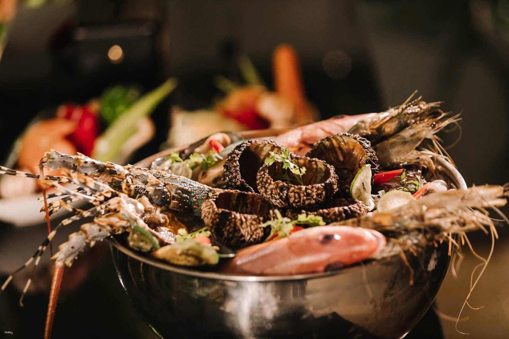 Savor an exquisite buffet featuring fresh seafood and international dishes at Sandals Restaurant complemented by an exciting Fire Dance Show creating a memorable evening in Phu Quoc.