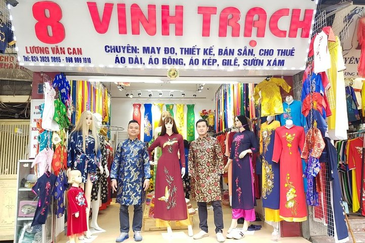 Experience the charm of Hanoi while trying on the elegant Ao Dai. Capture stunning photos surrounded by vibrant fabrics in a tailor store rich in tradition and craftsmanship.