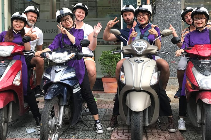 Explore the Unseen Saigon by Night with the AoDai Girls - Photo 1 of 5