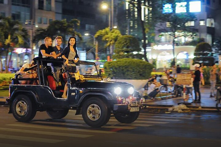 Exploring Saigon City & Rooftop Bar Drink By Night On Jeep Car - Photo 1 of 5