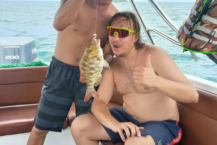 Experience the joy of fishing in the clear waters of Phu Quoc creating unforgettable memories with friends while catching local fish in a stunning tropical paradise. Enjoy the adventure!