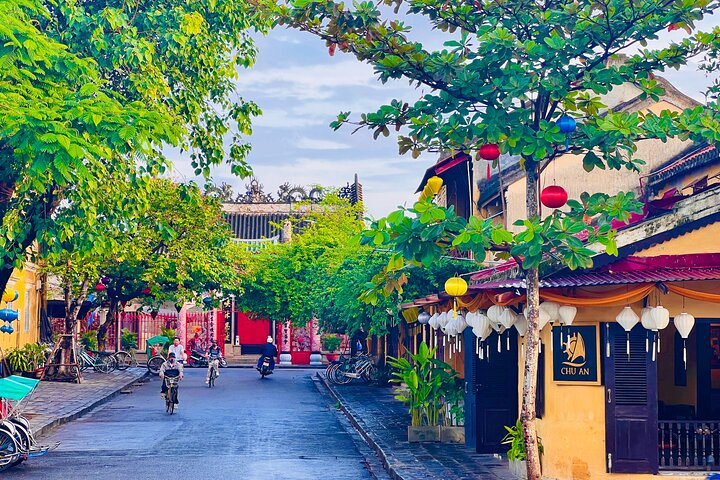 Feel the charm of Hoi An in the early morning light where local markets hum with activity and ancient streets invite exploration offering a unique glimpse into daily life.