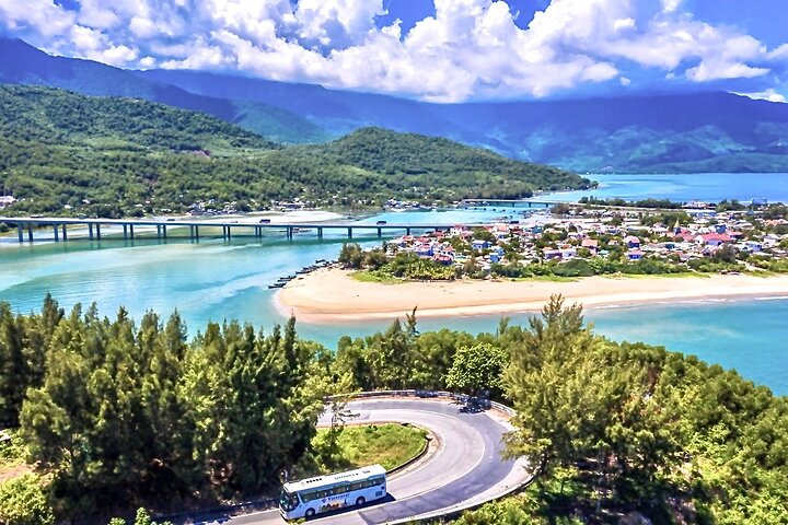 Experience the stunning landscapes of Vietnam as you journey through lush hills and scenic waterways discovering hidden gems along the way with a knowledgeable local driver.