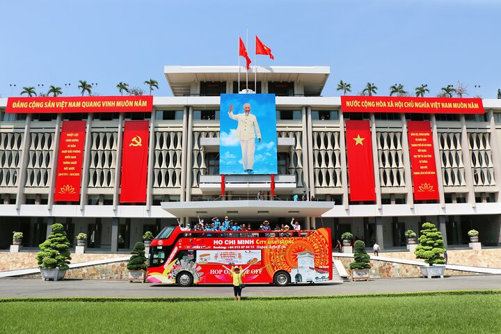 Experience the spirit of Ho Chi Minh City as you glide atop a double-decker bus taking in historic landmarks like Independence Palace where history unfolds with every turn.