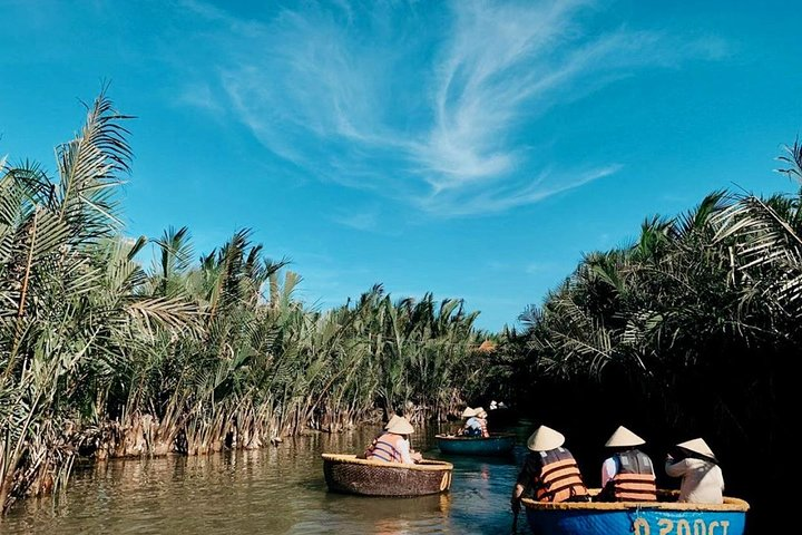 Explore the scenic waterways of Hoi An on a unique basket boat adventure surrounded by lush greenery and local charm combined with delicious Vietnamese cuisine for an unforgettable experience.