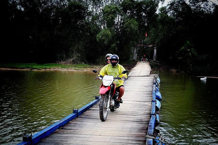 Experience the charm of Hoi An's countryside as you ride along scenic back roads crossing tranquil waterways and engaging with local farmers for an unforgettable day of exploration.