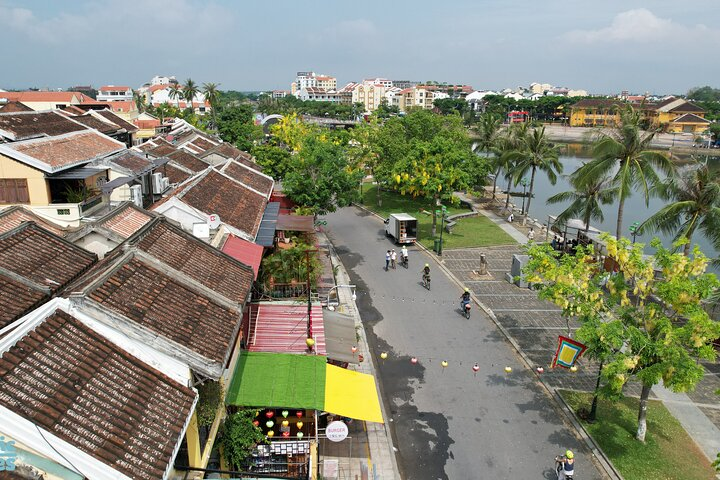Pedal through charming streets lined with traditional homes discover artisan workshops and soak in the beauty of Hoi An's rice paddies and serene riverside views on an unforgettable e-bike journey.