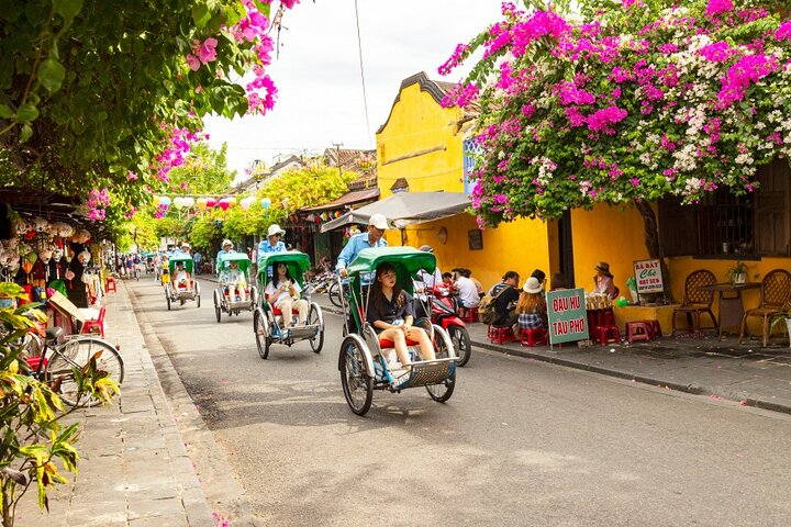 Experience the charm of Hoi An as you ride a rickshaw through historical streets savor delicious local dishes and discover hidden gems in a town rich in culture and tradition.
