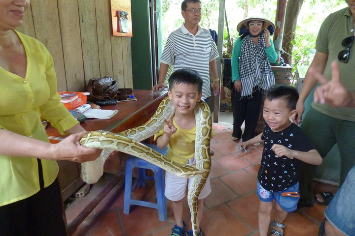 take some snap with python in mekong delta tour