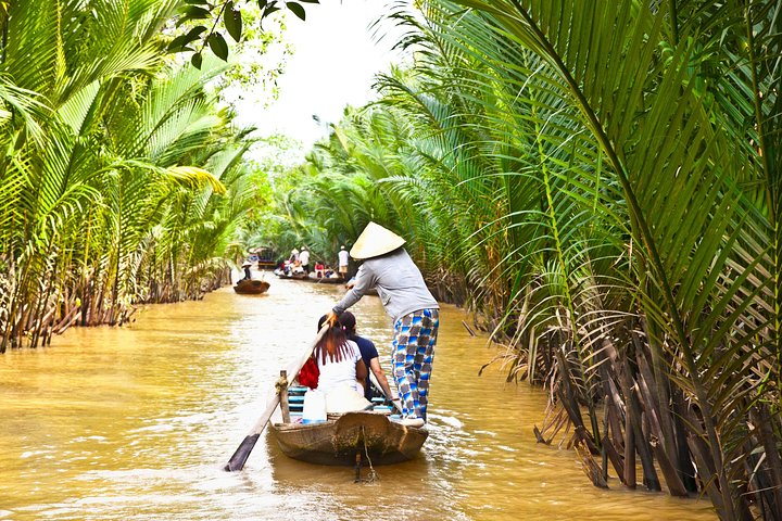 Experience the serenity of the Mekong Delta as you glide through lush canals surrounded by towering palms. Enjoy rowing boat adventures while soaking in the rich rural charm of Southern Vietnam.
