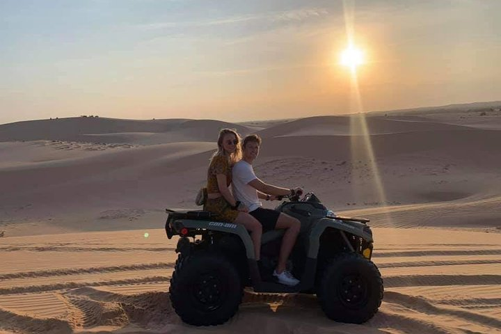 Ride across golden sand dunes as the sun sets experiencing the thrill of adventure with stunning views perfect for unforgettable memories in Mui Ne’s breathtaking landscape.