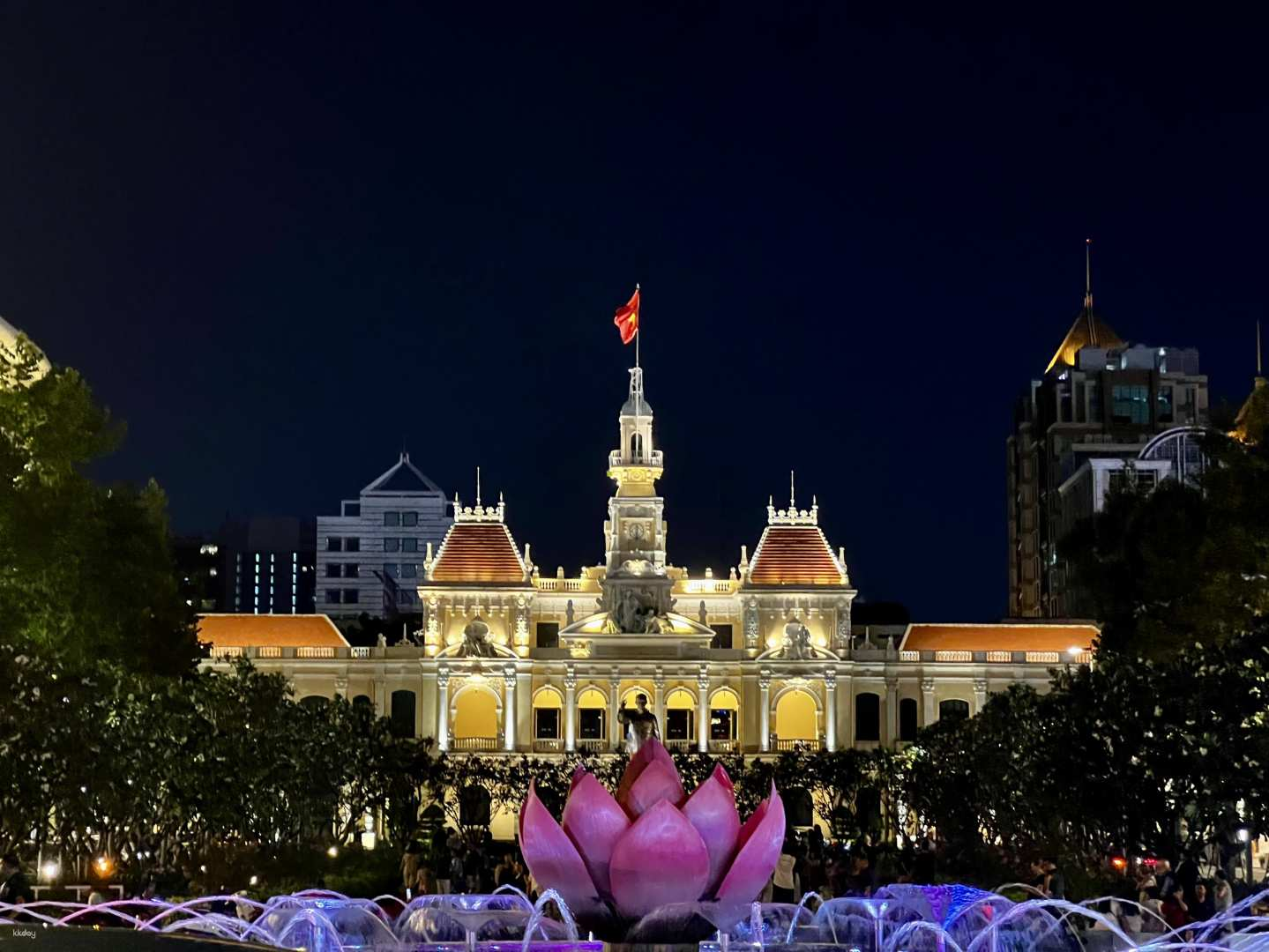 Experience Ho Chi Minh City's nightlife as you stroll past illuminated landmarks charming streets and picturesque water features revealing the essence of a city alive under the stars.