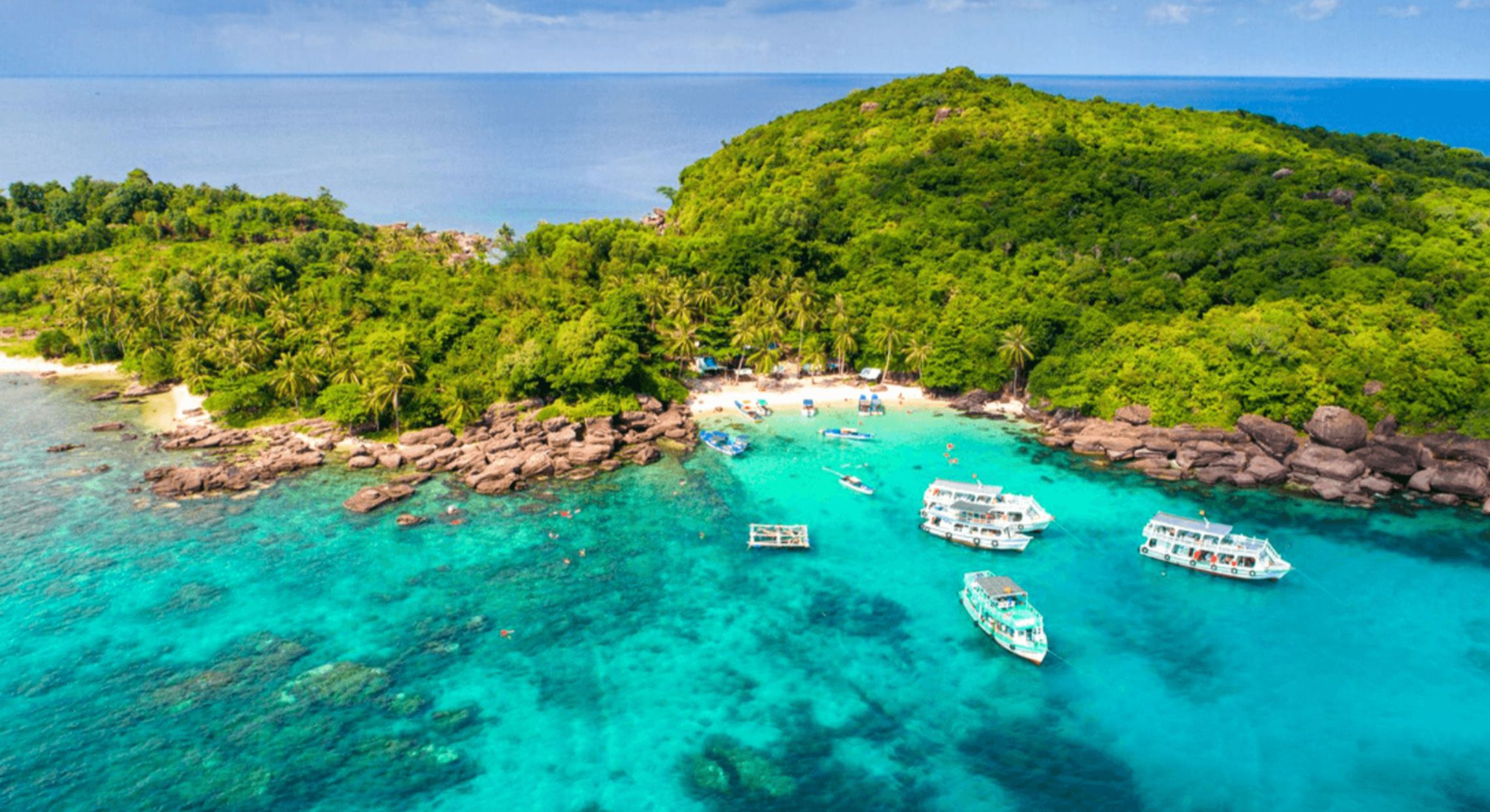 Explore the stunning landscapes of Phu Quoc's islands where turquoise waters meet lush greenery inviting you to dive into marine adventures and discover the island's fascinating culture.