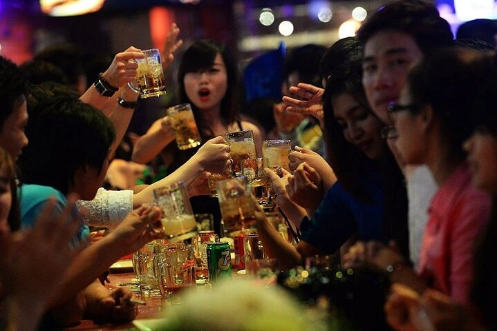 Gather with friends in Phu Quoc sipping craft beers and exploring local hotspots. Enjoy the night as laughter and clinking glasses create unforgettable memories in this lively setting.