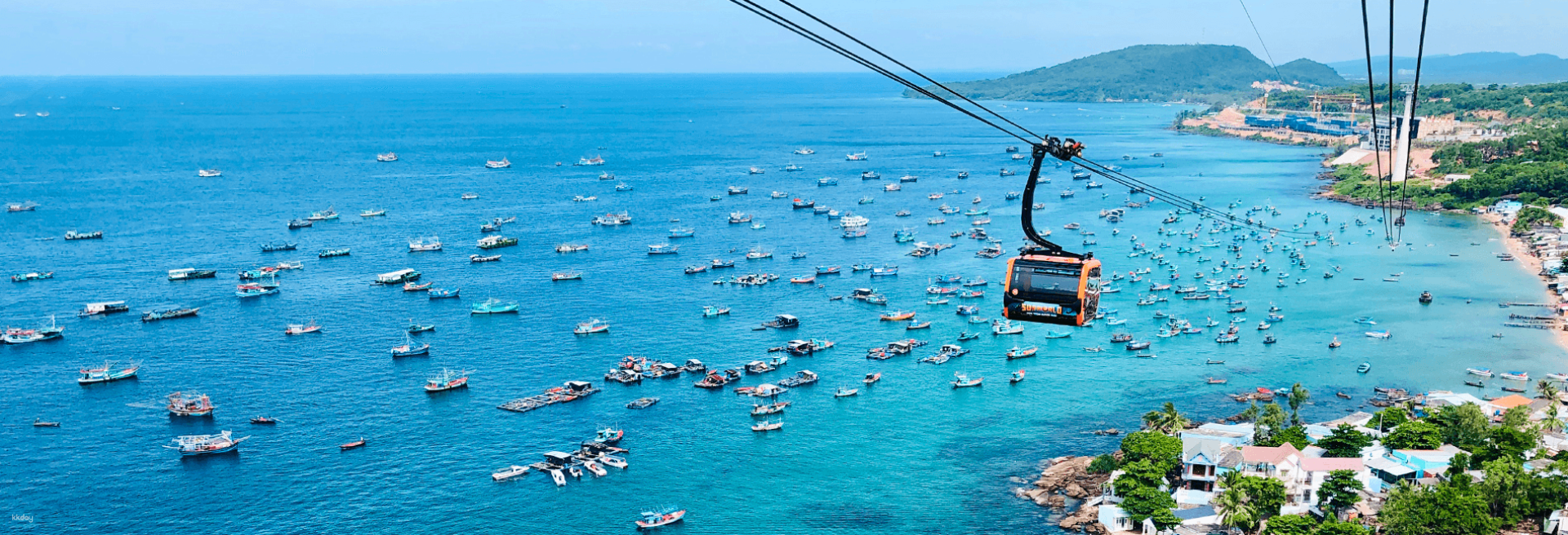 Experience breathtaking views of An Thoi Harbour and the sparkling waters below from the cable car connecting adventure with the serene beauty of Phu Quoc Island's coastline.