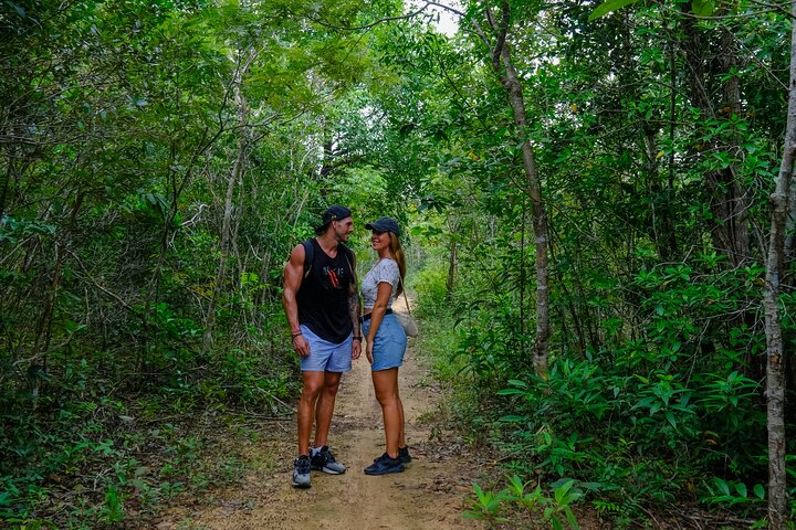 Explore the lush greenery of Tien Son Dinh encountering local flora and serene paths perfect for connecting with nature and each other amidst Phu Quoc's breathtaking landscape.