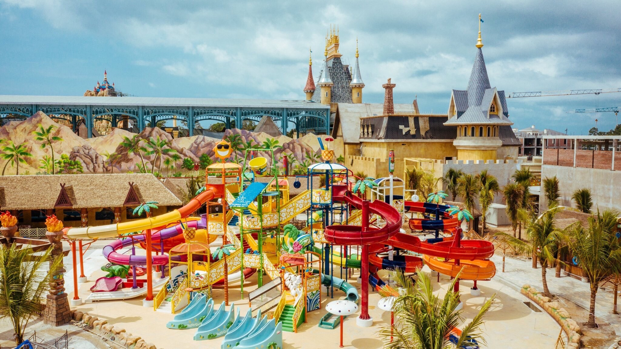 Dive into a world of fun at VinWonders Phu Quoc where colorful slides playful water features and whimsical architecture invite families to create unforgettable memories together.