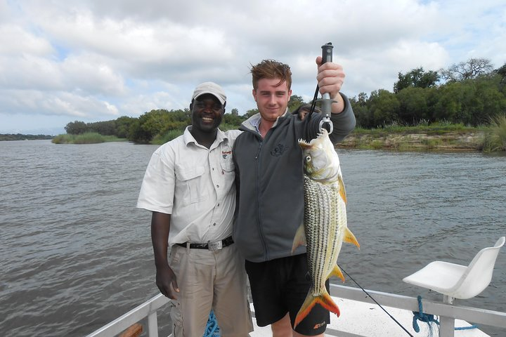 Happy successful Tiger catch at the upper Zambezi